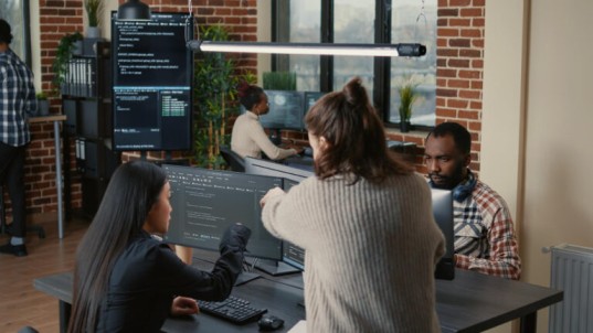 People working together in a modern office, representing collaboration in the service section of a website.